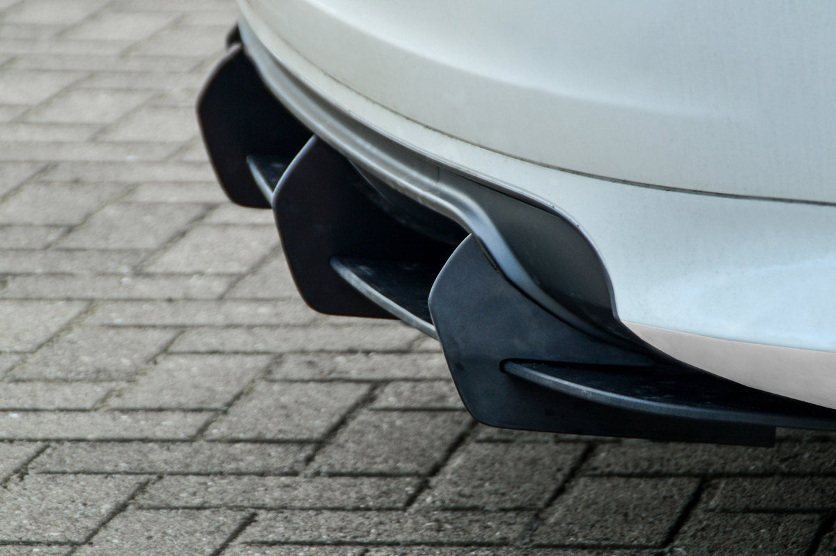 Gefräster Heckansatz für Audi S3 8P von Ingo Noak Tuning, zeigt detaillierte Oberfläche und Passform an der Fahrzeugheckpartie.